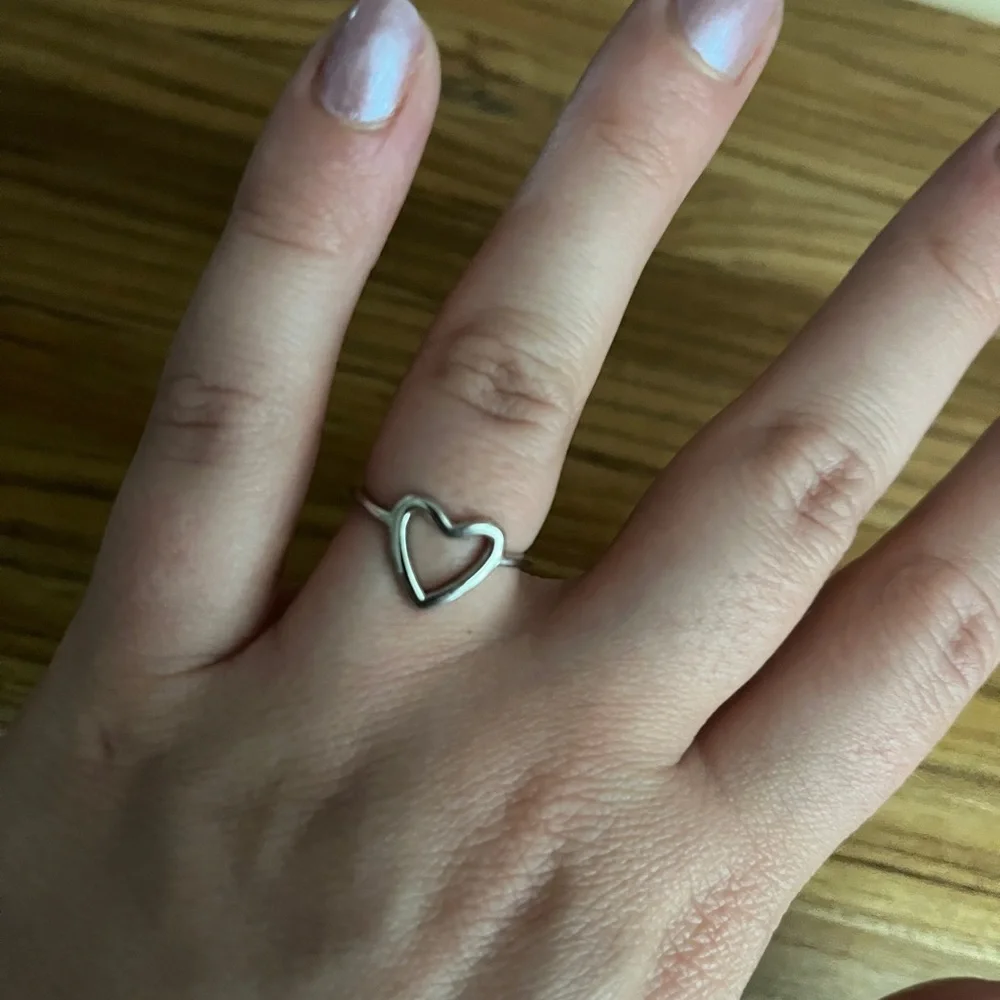 New silver tone heart shaped ring adjustable band one size fits most